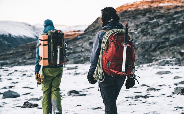A person ice hiking with a Guide's Edition Synapse 25.